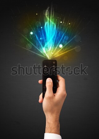 Kéz távirányító robbanékony jel tart ragyogó Stock fotó © ra2studio