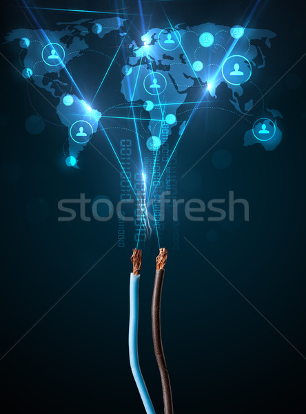 Social network icons coming out of electric cable Stock photo © ra2studio