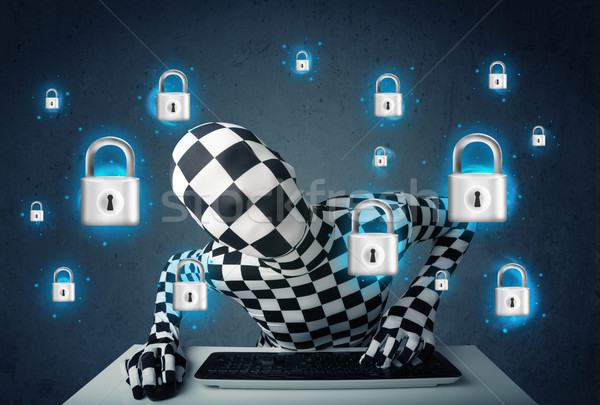 Hacker in disguise with virtual lock symbols and icons Stock photo © ra2studio