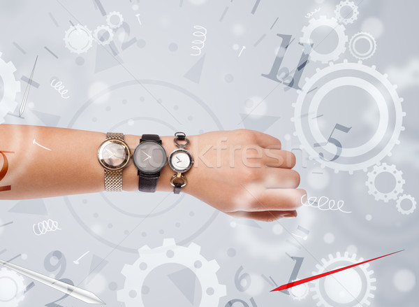 Hand with watch and numbers on the side comming out Stock photo © ra2studio