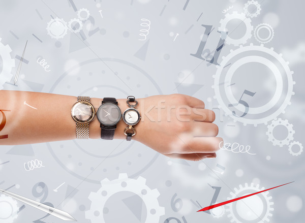 Hand with watch and numbers on the side comming out Stock photo © ra2studio