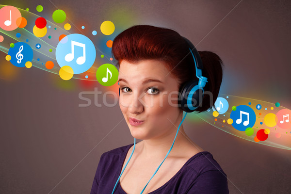 [[stock_photo]]: Jeune · femme · écouter · de · la · musique · casque · joli · bulles · musique