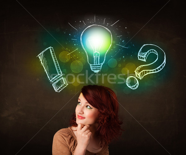 Stock photo: Young preety teenager with hand drawn light bulb illustration