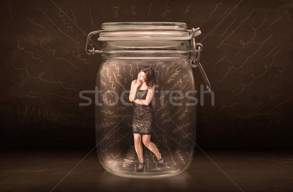 Businesswoman inside a jar with powerful hand drawn lines concep Stock photo © ra2studio