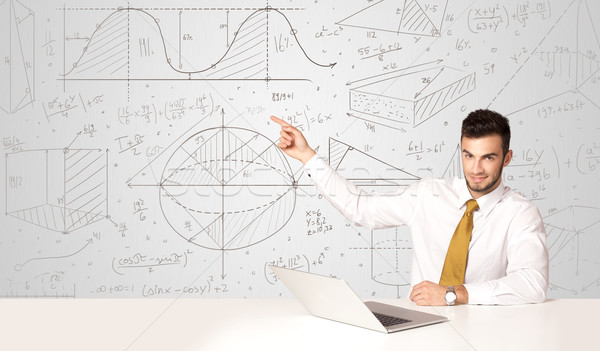 Stock photo: Businessman with business calculations background