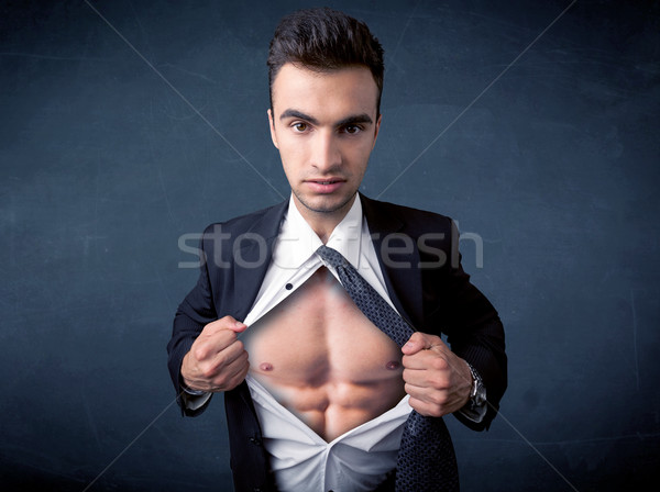 Businessman tearing off shirt and showing mucular body Stock photo © ra2studio