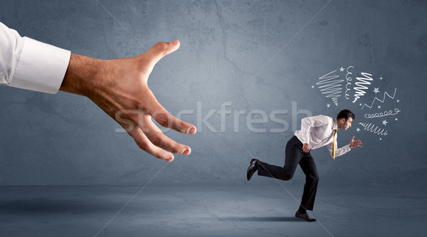 Stressful businessman running from a big hand  Stock photo © ra2studio