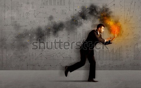 Fut üzletember tűz laptop sietség üzlet Stock fotó © ra2studio