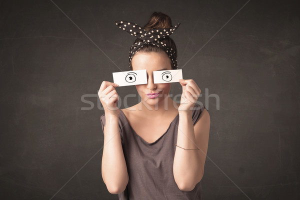 Funny woman looking with hand drawn paper eyes Stock photo © ra2studio