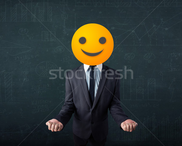 businessman wears yellow smiley face Stock photo © ra2studio