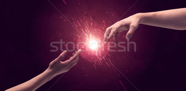 Touching hands light up sparkle in space Stock photo © ra2studio