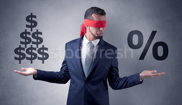 Man with ribbon on his eye holding dollar signs Stock photo © ra2studio
