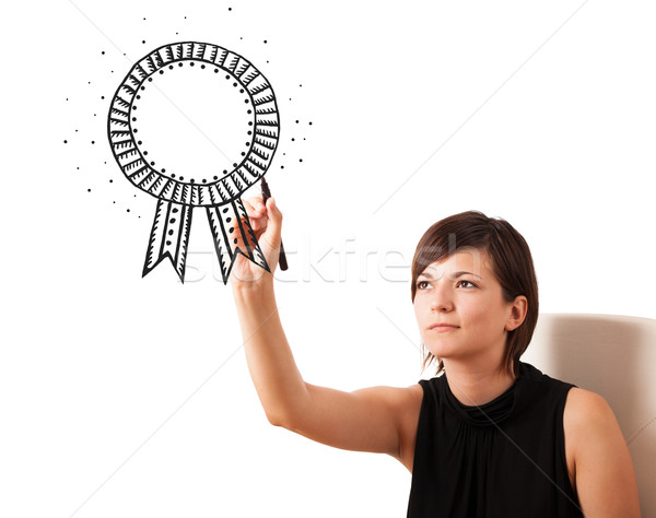 Stock photo: Young woman drawing a ribbon on whiteboard 