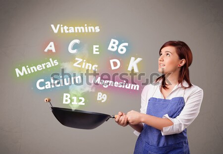 Young woman cooking vitamins and minerals Stock photo © ra2studio