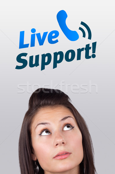 Young girl looking at support contact type of icons and signs Stock photo © ra2studio