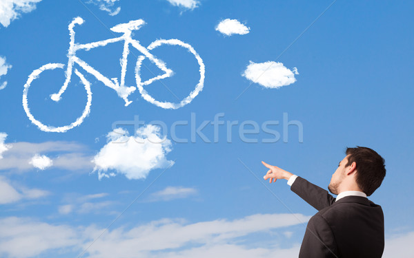 Genç bakıyor bisiklet bulutlar mavi gökyüzü genç Stok fotoğraf © ra2studio