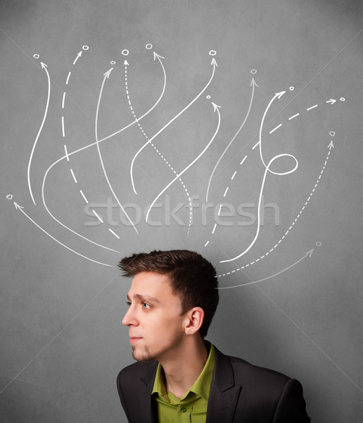 Businessman with arrows coming out of his head Stock photo © ra2studio