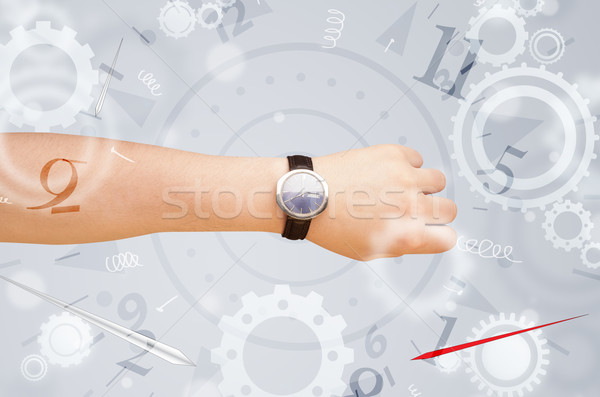 Hand with watch and numbers on the side comming out Stock photo © ra2studio