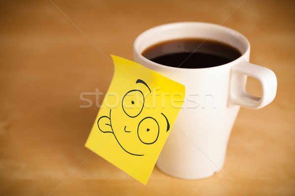 Post-it note with smiley face sticked on a cup Stock photo © ra2studio