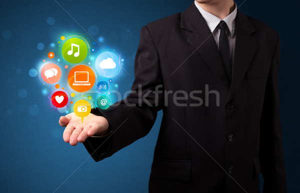 Multimedia Symbole Hand Geschäftsmann jungen halten Stock foto © ra2studio