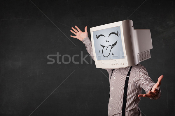 Happy business man with a computer monitor and a smiley face Stock photo © ra2studio