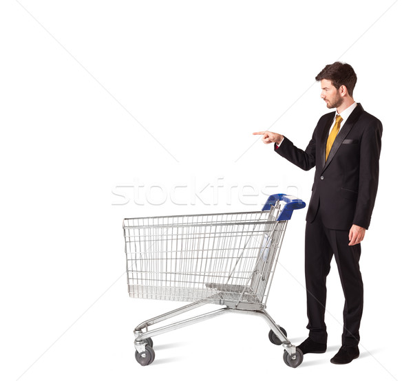 üzletember bevásárlókocsi toló izolált öltöny bolt Stock fotó © ra2studio