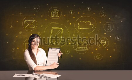 businesswoman with all kind of hand-drawn media icons Stock photo © ra2studio