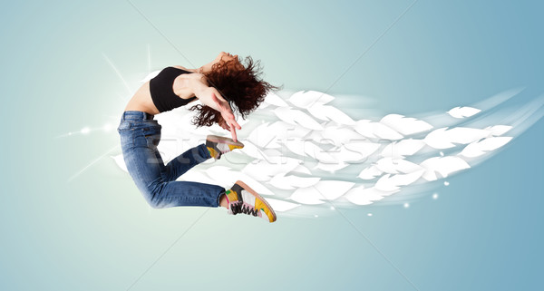 健康 若い女性 ジャンプ 羽毛 周りに 明るい ストックフォト © ra2studio