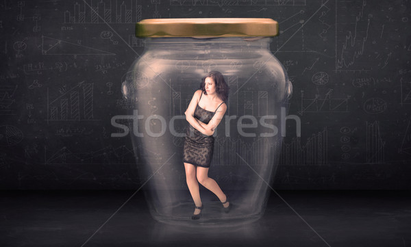 Businesswoman shut inside a glass jar concept Stock photo © ra2studio