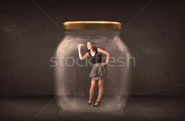 Businesswoman captured in a glass jar concept Stock photo © ra2studio