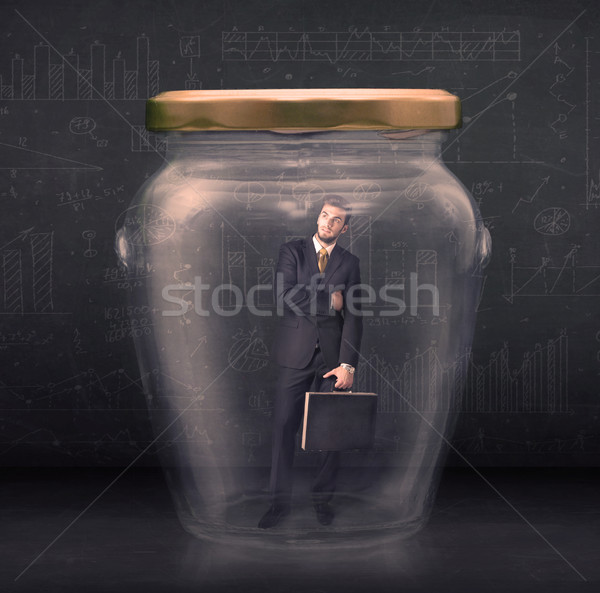 Stock photo: Business man closed into a glass jar concept