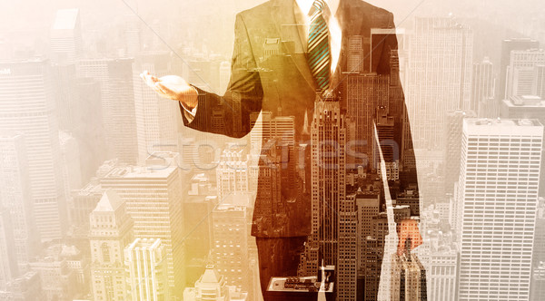 Business man looking at overlay city background Stock photo © ra2studio