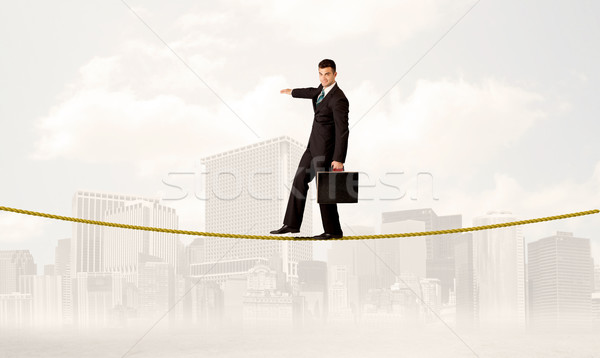 üzletember egyensúlyoz arany kötél fiatal elegáns Stock fotó © ra2studio