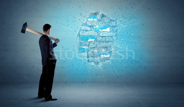 Business man hitting brick wall with huge hammer Stock photo © ra2studio