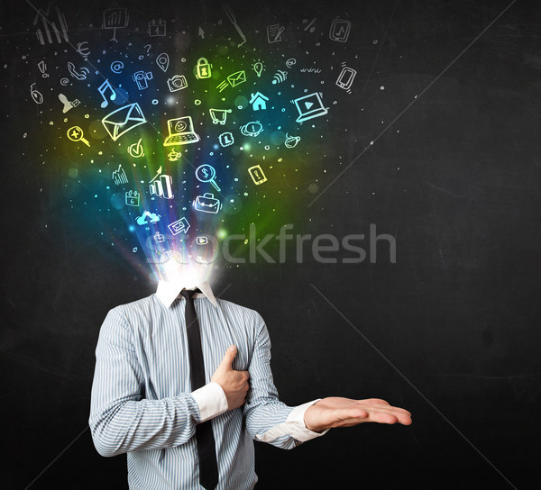 Business man with glowing media icons exploding head  Stock photo © ra2studio