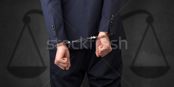 Arrêté homme équilibre affaires menottes mains Photo stock © ra2studio