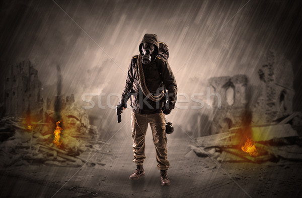 After catastrophe men coming in gas mask and arms Stock photo © ra2studio
