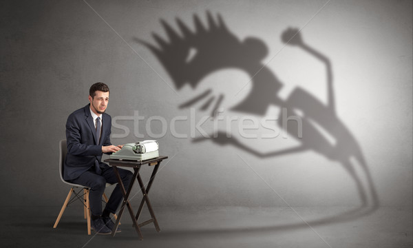 Man working and he is afraid of a yelling shadow Stock photo © ra2studio