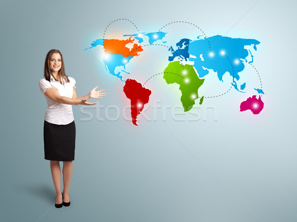 Young woman presenting colorful world map Stock photo © ra2studio