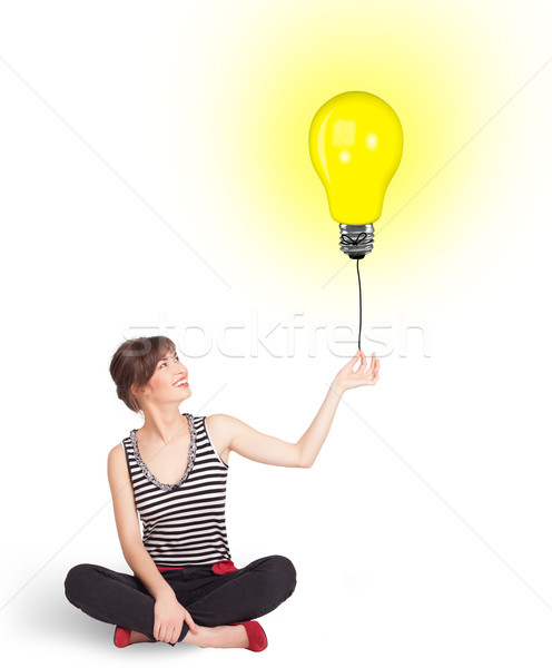 Heureux femme ampoule ballon jeune femme [[stock_photo]] © ra2studio