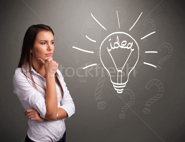 Young girl comming up with a light bubl idea sign Stock photo © ra2studio