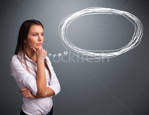 Young lady thinking about speech or thought bubble with copy spa Stock photo © ra2studio