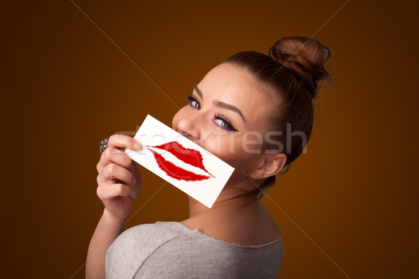 Heureux jolie femme carte baiser rouge à lèvres [[stock_photo]] © ra2studio