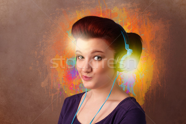 Young woman with headphones listening to music Stock photo © ra2studio