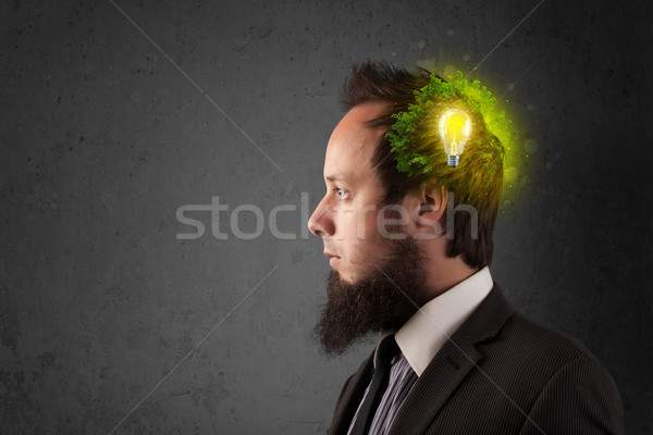 Young mind thinking of green eco energy with lightbulb Stock photo © ra2studio