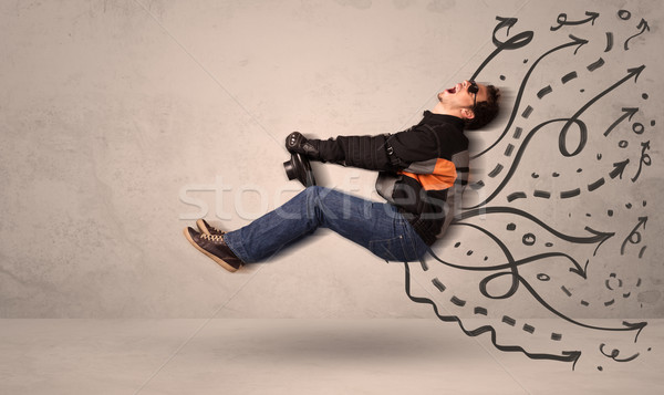 Funny man driving a flying vehicle with hand drawn lines after h Stock photo © ra2studio
