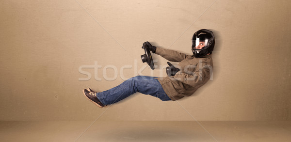Happy funny man driving a flying car concept Stock photo © ra2studio