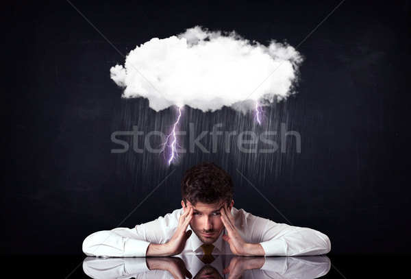 Depressed businessman sitting under a cloud Stock photo © ra2studio