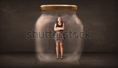 Businesswoman captured in a glass jar concept Stock photo © ra2studio
