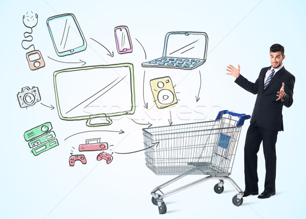 Businessman with shopping cart Stock photo © ra2studio